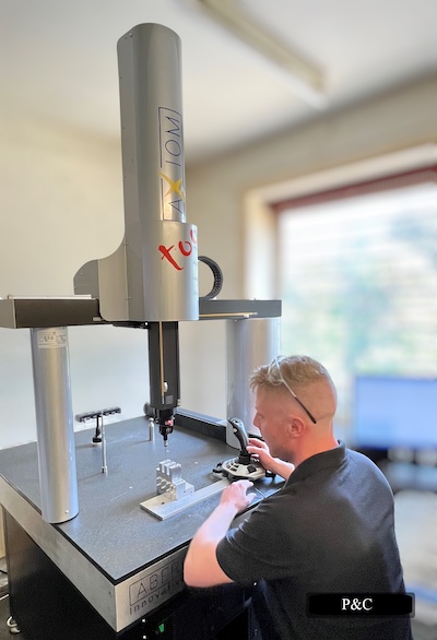 A man using a machine at P and C Precision Engineers Ltd